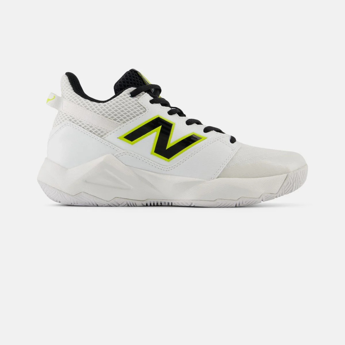 Side profile of a white New Balance tennis shoe on a white background, featuring a breathable mesh and synthetic upper, neon yellow‑outlined &ldquo;N&rdquo; logo, black laces, reinforced toe area, and a durable rubber outsole designed for court traction. 