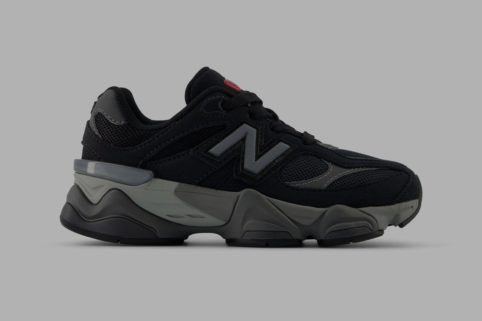 Side shot of black New Balance 9060.