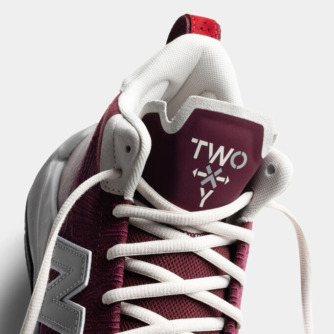 Detail photo of the maroon shoe focusing on the tongue.