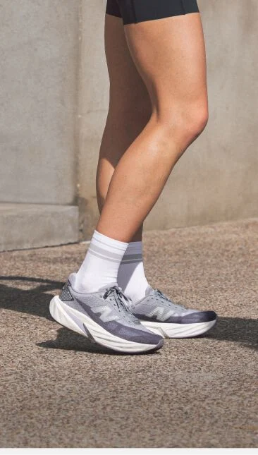 Side profile on-figure knee down shot of the grey shoes