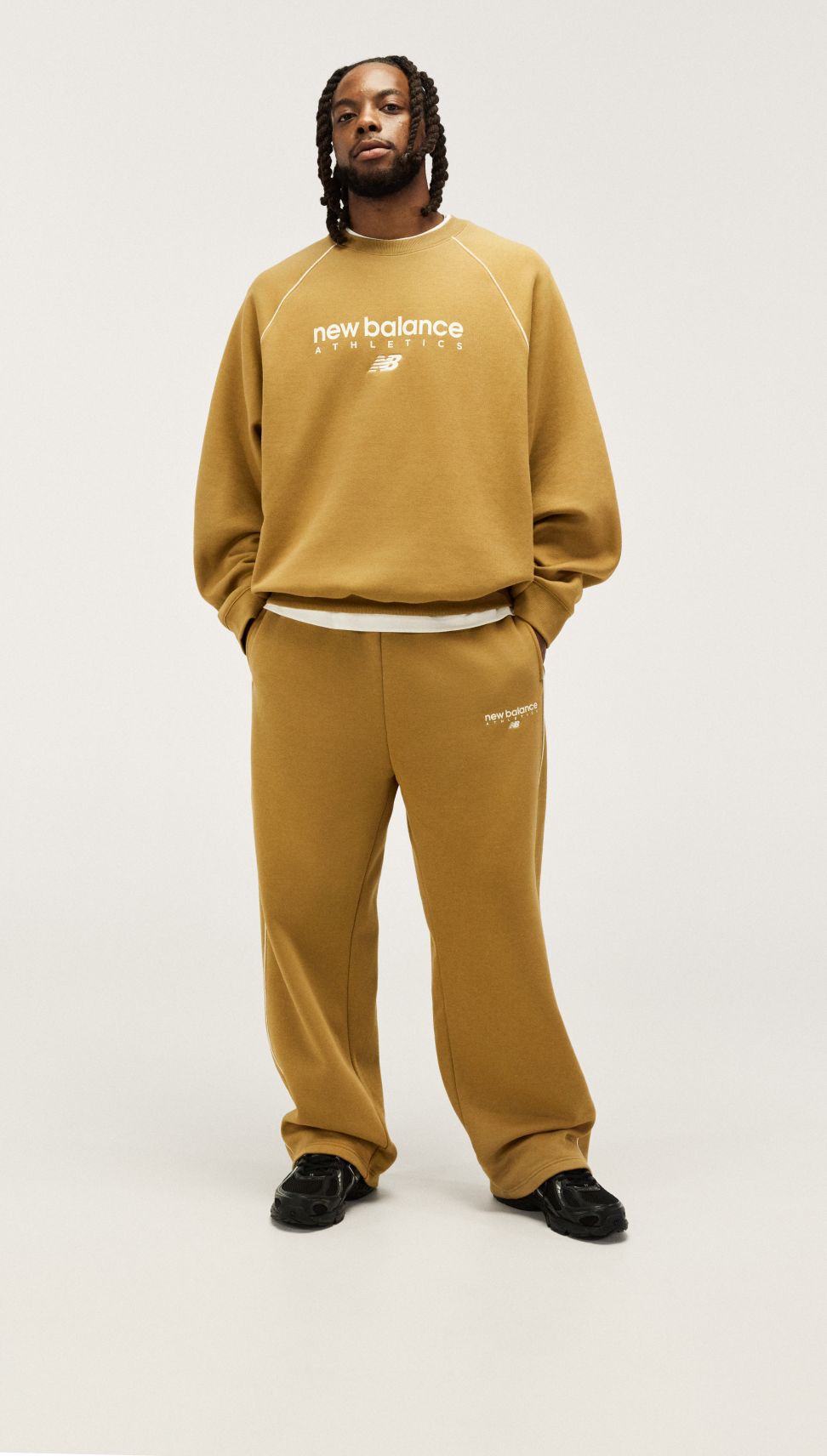 Darius Garland wearing trackside apparel in studio. 