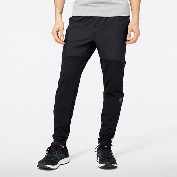 Black pants and black shoes on a young man. 