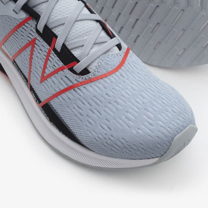 Top down detail show of the mesh upper on the men’s steel colored FuelCell Propel.