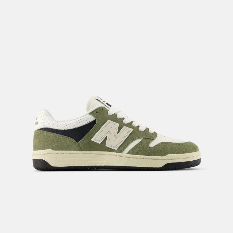 Green shoes with a cream logo.