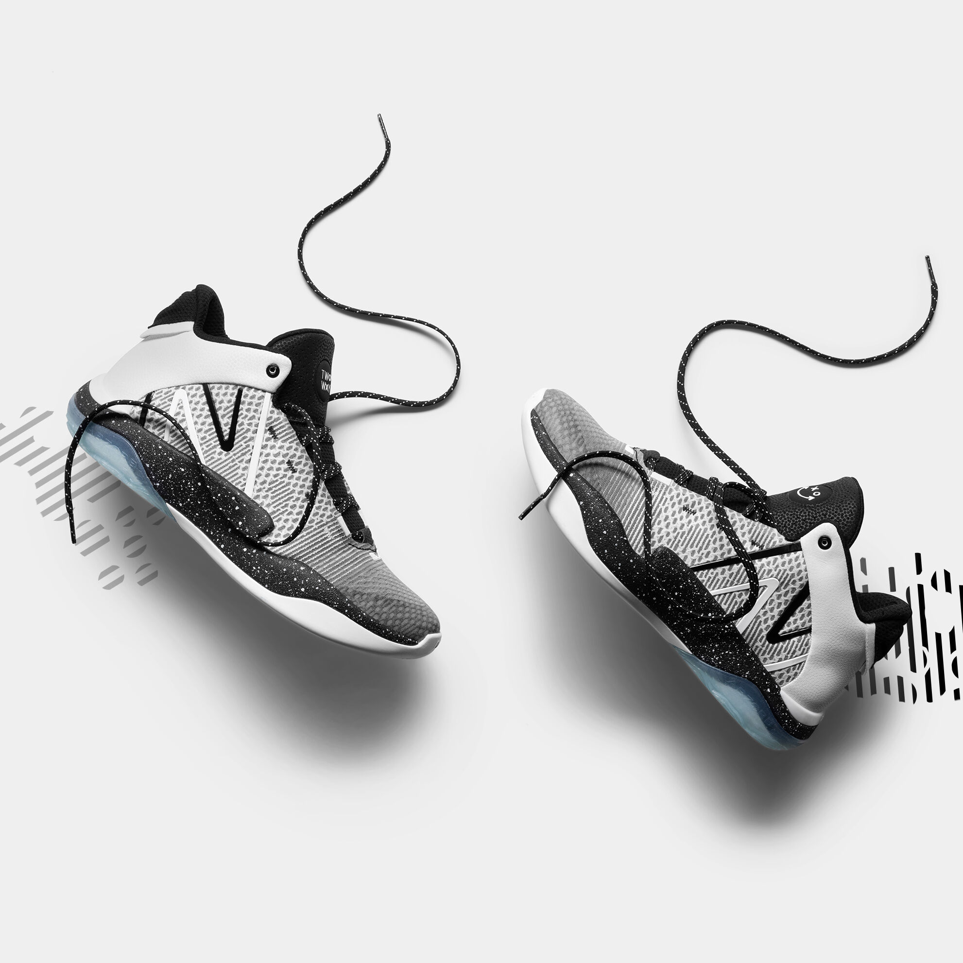 Two shoes in a relaxed position on a light grey background.