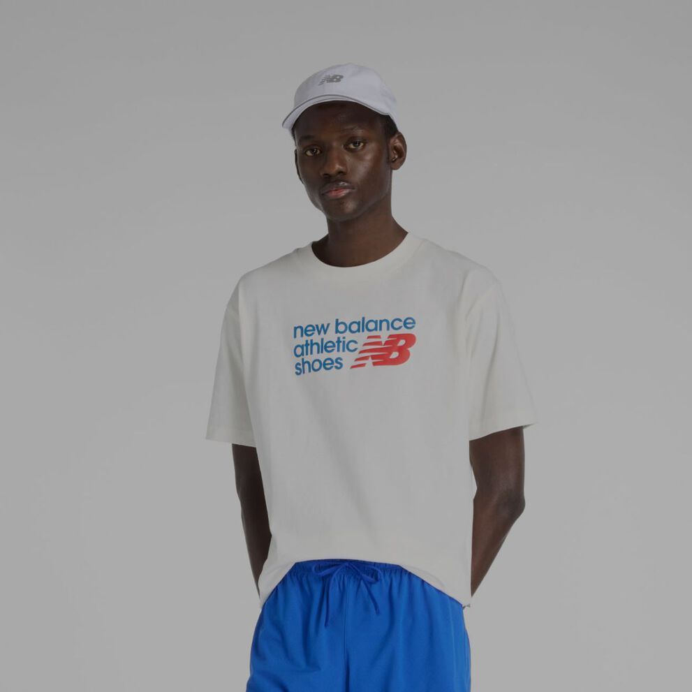 Man wearing white New Balance shirt.