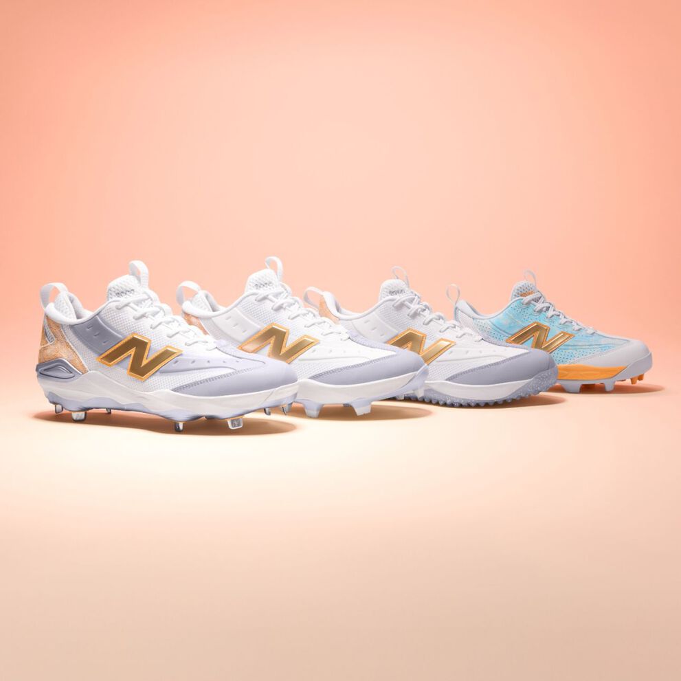 Lateral view of four baseball cleats on a light pink gradient background.