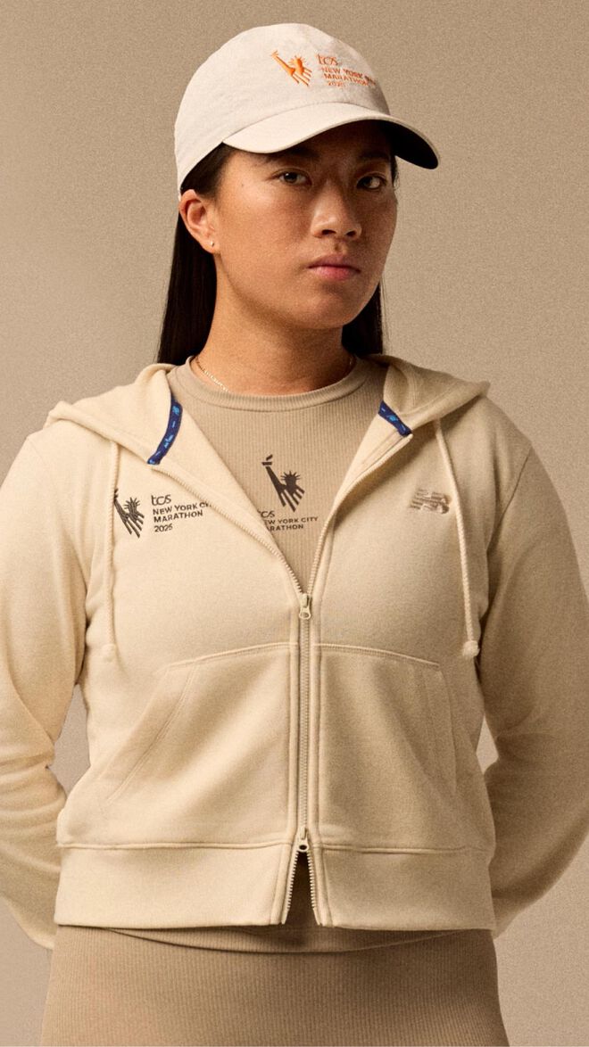 Woman wearing New York City Marathon accessories