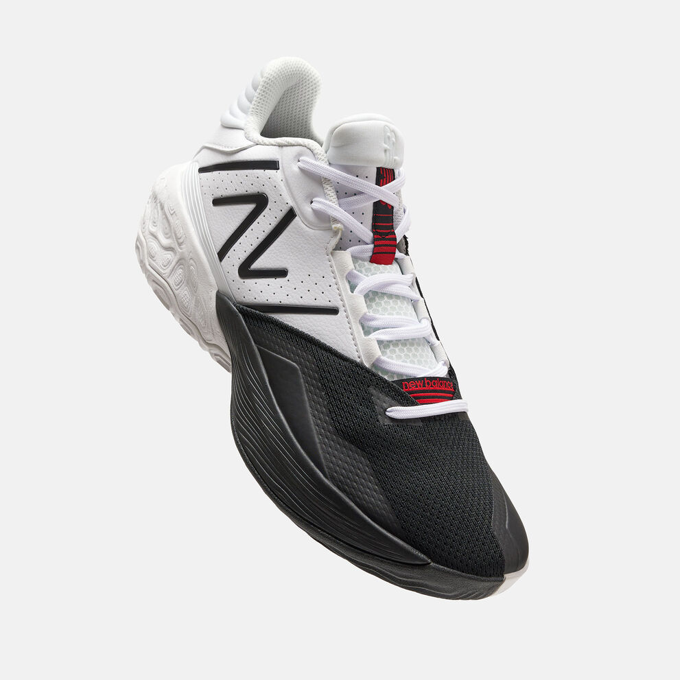 Pair of TWO WXY v4 ‘Dualism’ shoes in white and black with red accents posed against a grey studio backdrop