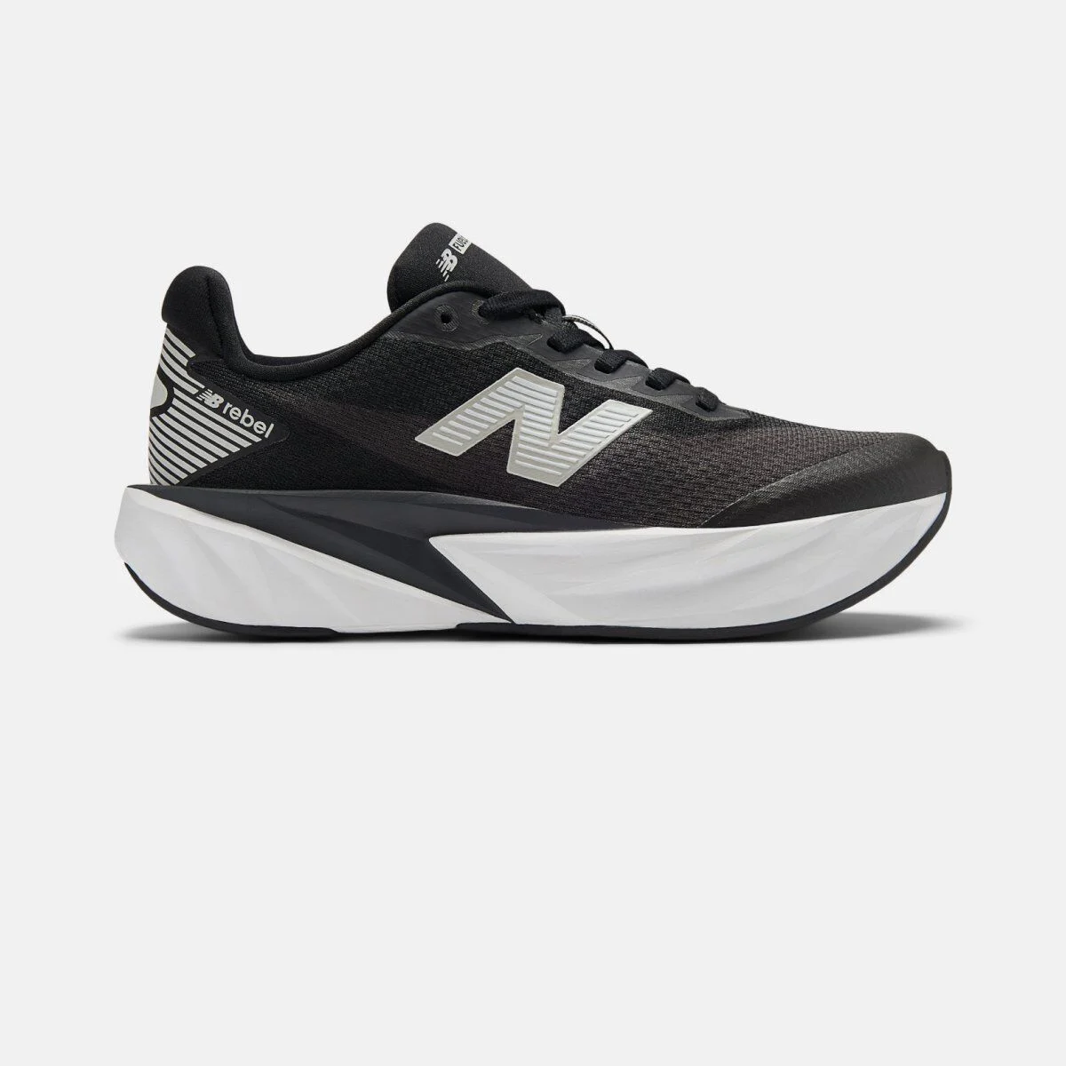 Side profile of a black New Balance running shoe on a white background, featuring a breathable mesh upper, reflective silver &ldquo;N&rdquo; logo, padded collar, and a thick sculpted white and black midsole. 