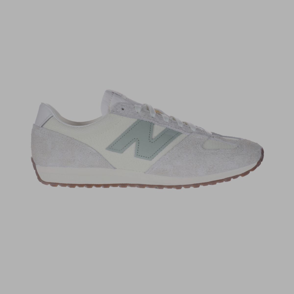 A white 471 shoe with a light green logo.