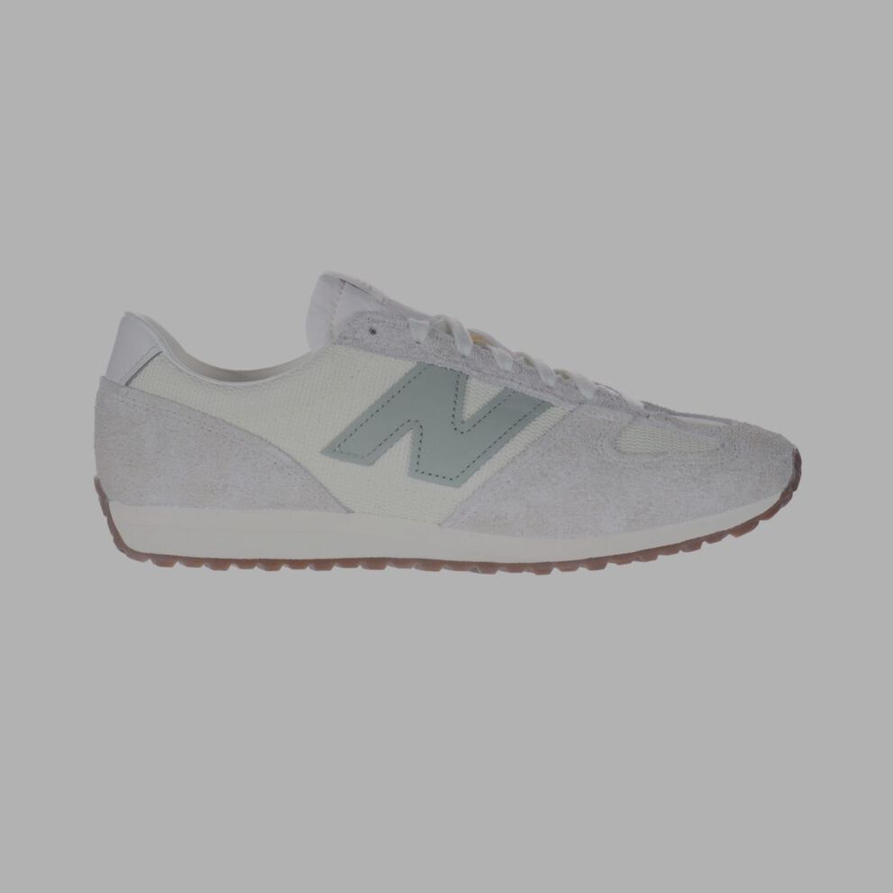 A white 471 shoe with a light green logo.