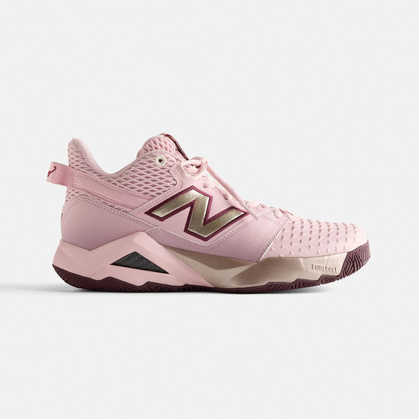  One CG2 shoes on a grey background.