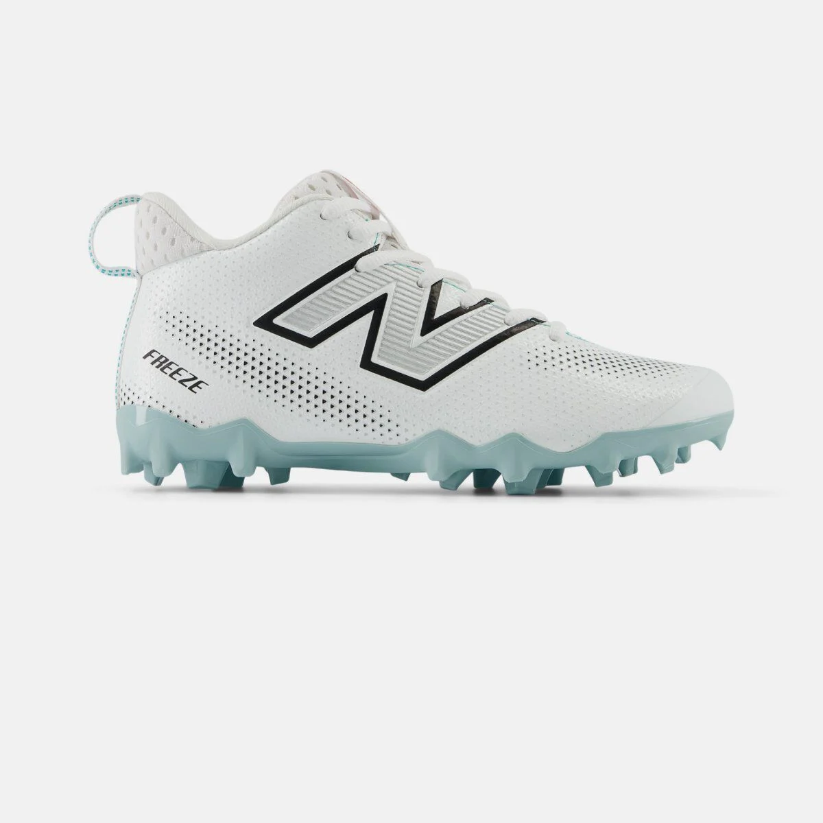 Side profile of a white New Balance lacrosse cleat on a white background, featuring a perforated synthetic upper, black‑outlined &ldquo;N&rdquo; logo, mid‑cut ankle collar, molded teal studs for field traction, and &ldquo;FREEZE&rdquo; text near the heel. 