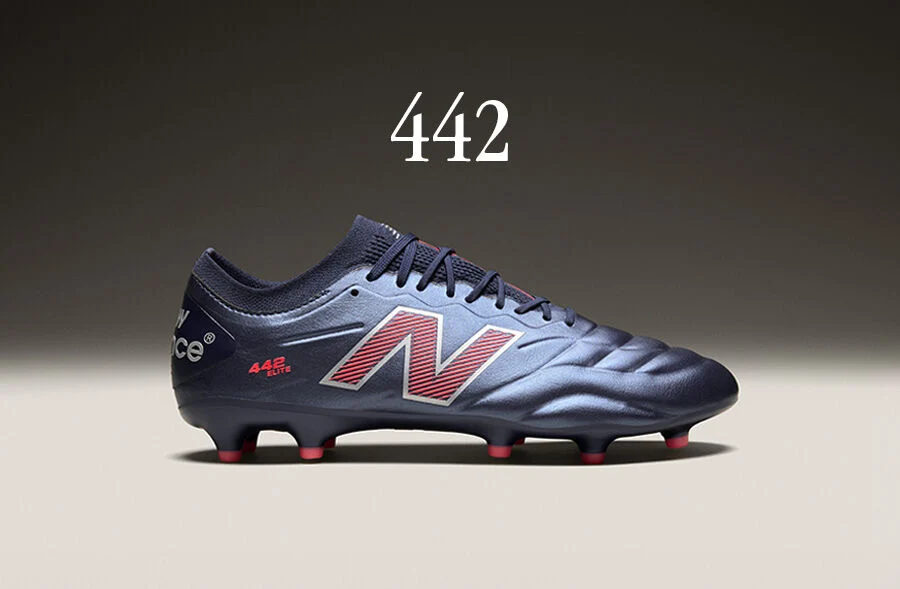 Side view of blue 442 soccer cleat.