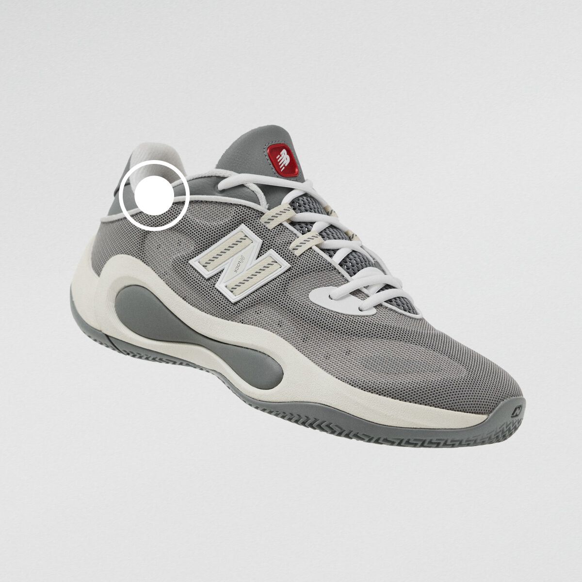 Gray New Balance athletic sneaker with a breathable mesh upper, white laces, and sculpted cushioned sole.