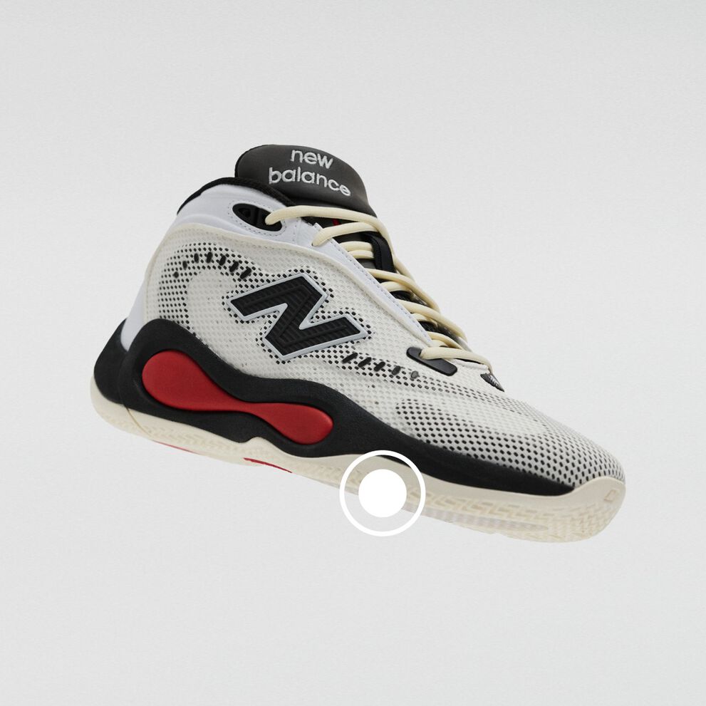 White, black, and red New Balance athletic sneaker with a knit upper, high-cut collar, and cushioned midsole.