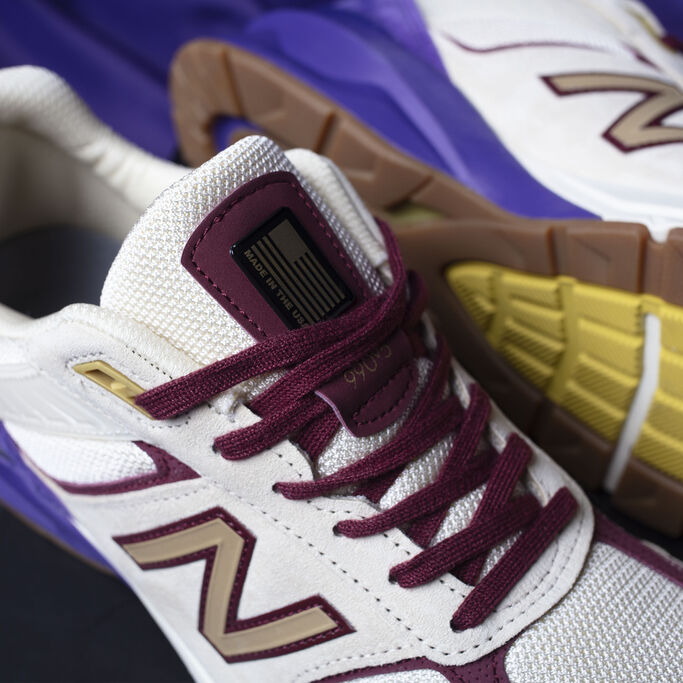 Close up detail shot of the Black History Month exclusive 990 that showcases gold accents on tongue.
